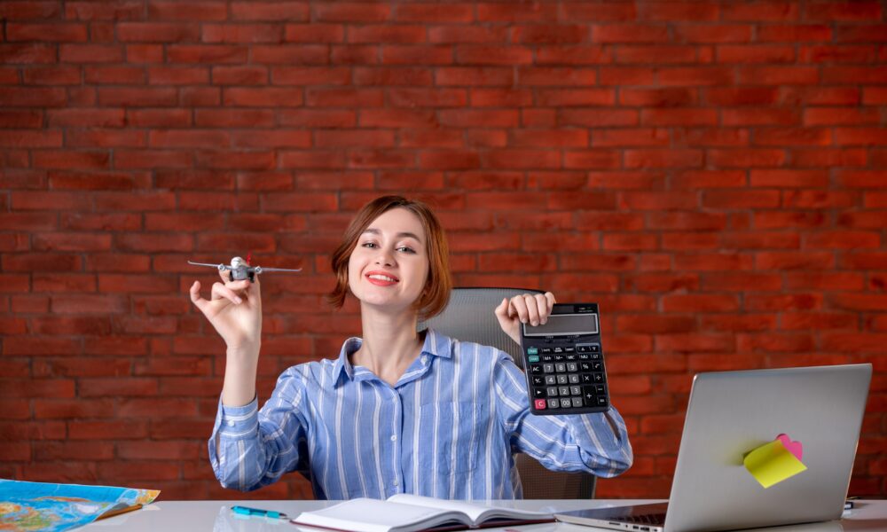Smart Money Habits: 7 Personal Finance Tips to Build Wealth in 2025 Person calculating savings and investments at a desk
