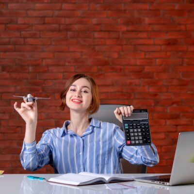Smart Money Habits: 7 Personal Finance Tips to Build Wealth in 2025 Person calculating savings and investments at a desk