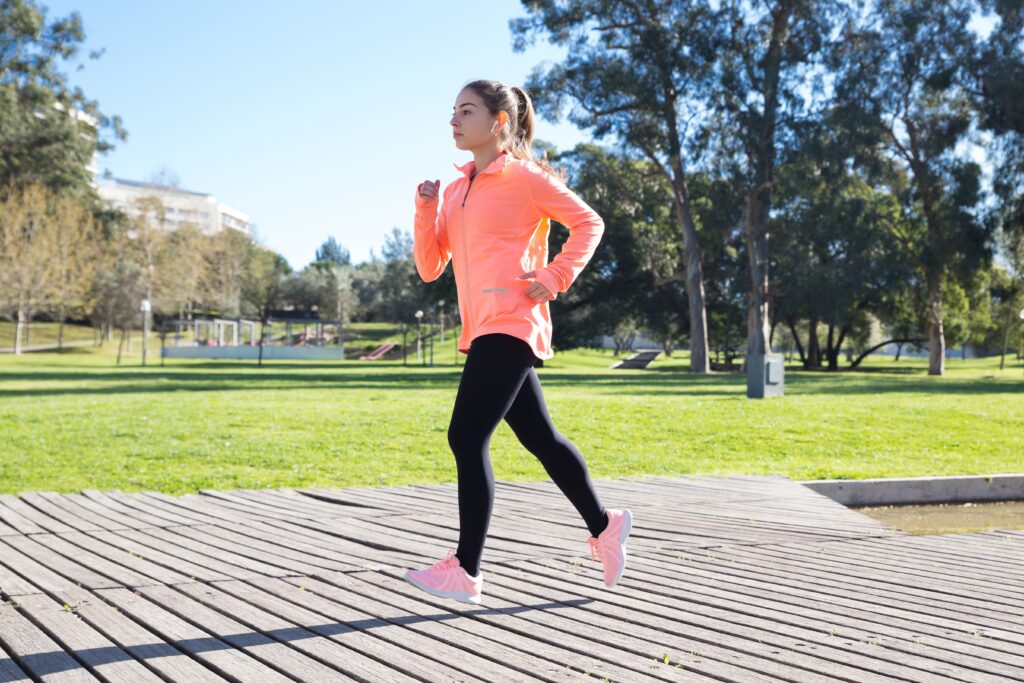 young-attractive-woman-jogging-city-park